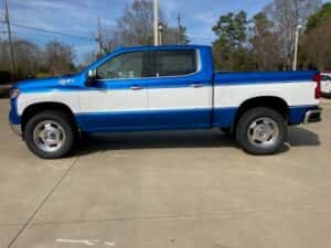 Custom chevy pickup truck blue with white side panel driver side profile