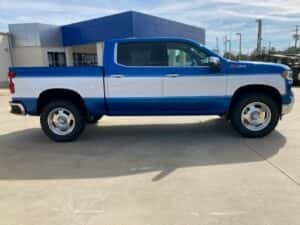 Custom chevy pickup truck blue with white side panel passenger rear angle