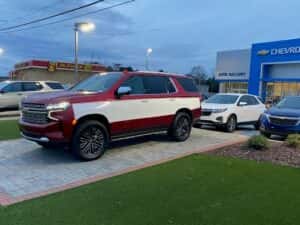 Custom chevy suv tahoe red with white side panel driver side profile