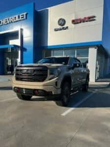 tan custom gmc pickup parked 2