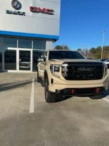 tan custom gmc pickup parked