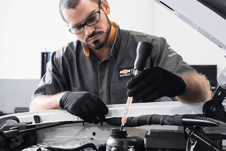 Chevrolet-Service-Technician-looking-at-Cars-Engine-Mobile