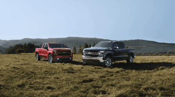 An exterior shot of two Ford trucks