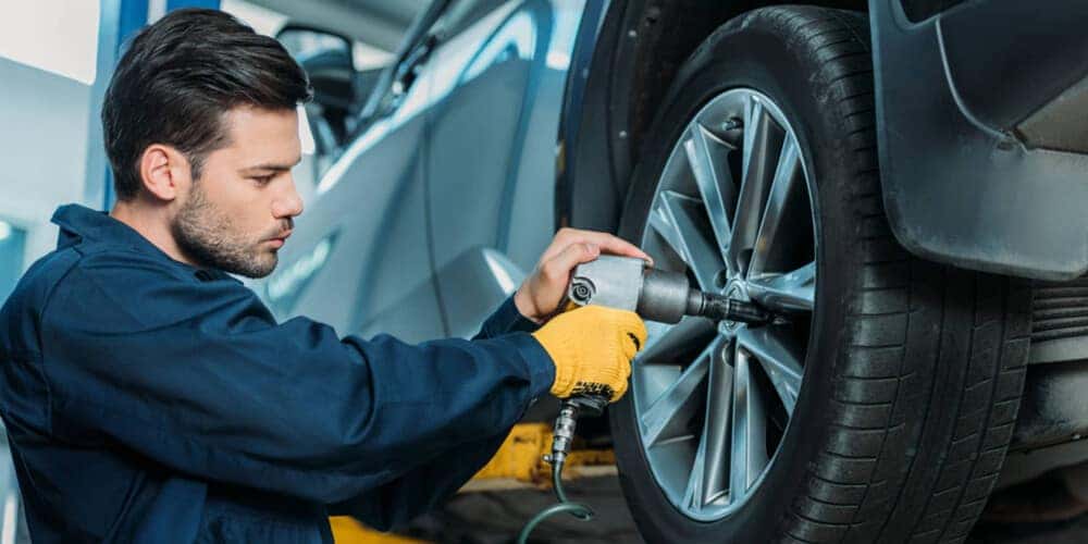 Serviceman working on tires