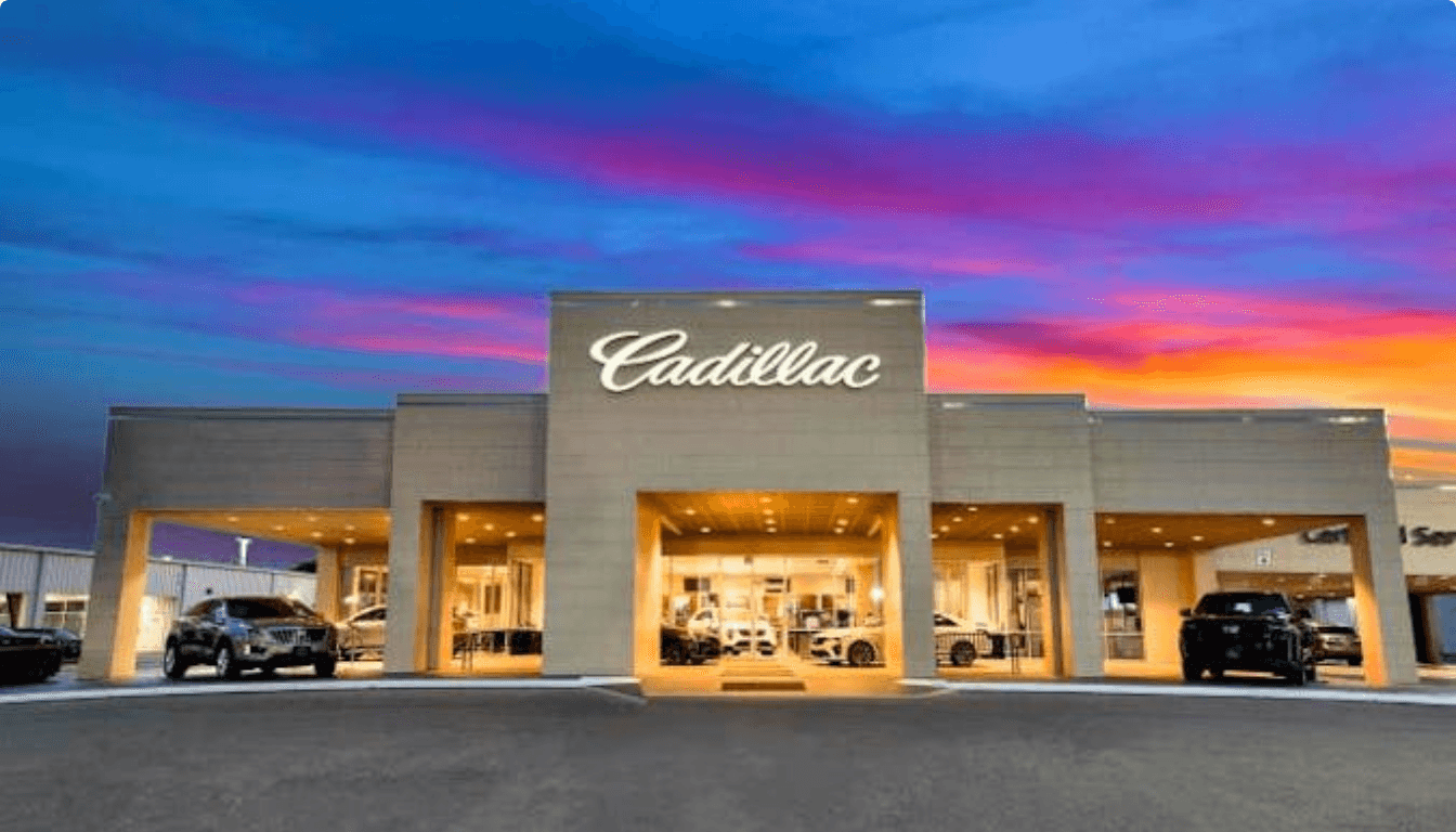 Covert Cadillac dealership exterior at evening