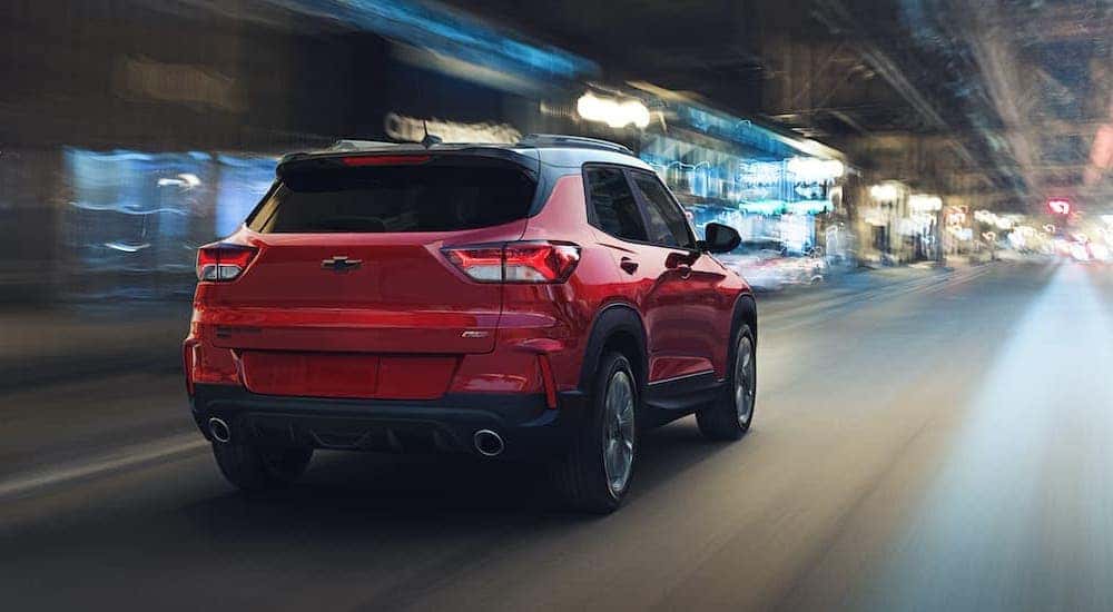 A red 2021 Chevy Trailblazer RS is shown driving through a blurred tunnel.