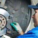 Mechanic-fitting-brake-pads-header-57108131
