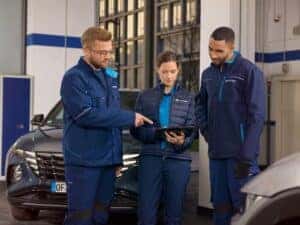 Hyundai mechanic performing winter maintenance service, available with same-day service appointments at Edwards Hyundai in Council Bluffs, IA.