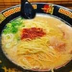A bowl of tasty looking hot ramen noodles in broth.