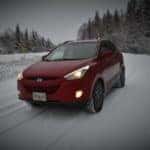 Red Hyundai driving in winter
