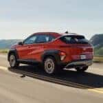 2024 Hyundai Kona in red on a highway in Auburn, AL
