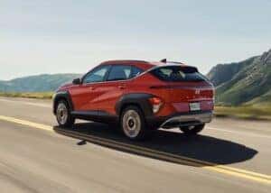 2024 Hyundai Kona in red on a highway in Auburn, AL
