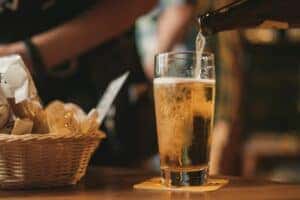 Pouring a beer at a brewery in Auburn, AL