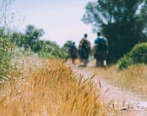 3 hikers walking along a trail in Auburn, AL