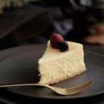 A delicious slice of cheesecake with berries on top at a shop in Montgomery, AL