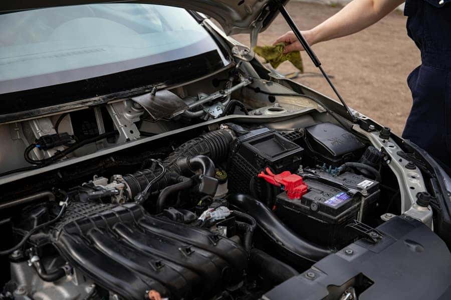 Open Hood with Battery in Car