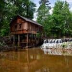 Landscape Photography of Brown Wooden House on Forest Near River