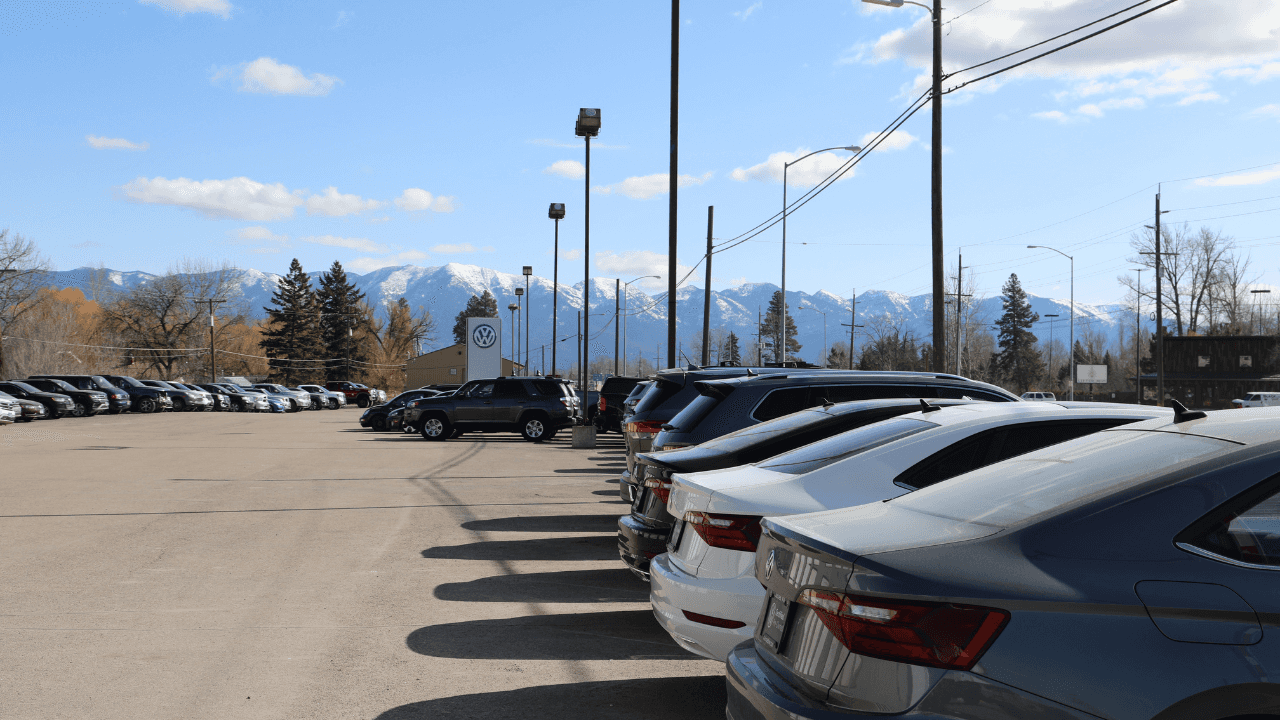 Kalispell Volkswagen dealership with mountains in the background