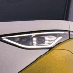 headlight of a white and gold ID Buzz