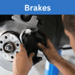 Technician replacing brakes