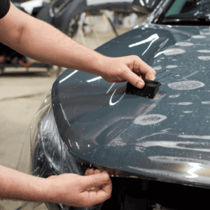Kalispell Volkswagen Technician installing Clear Shield