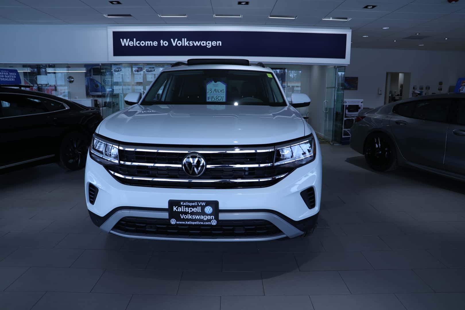 White 2023 Volkswagen Atlas in the Kalispell Volkswagen Showroom