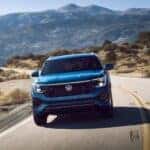 2025 Volkswagen Atlas Cross Sport driving through a mountain over pass