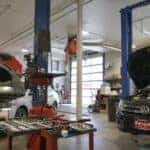 Some Volkswagen vehicles being worked on in the Kalispell Volkswagen service bay