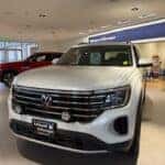 White 2026 Volkswagen Atlas sitting the Kalispell Volkswagen showroom in Northwest Montana