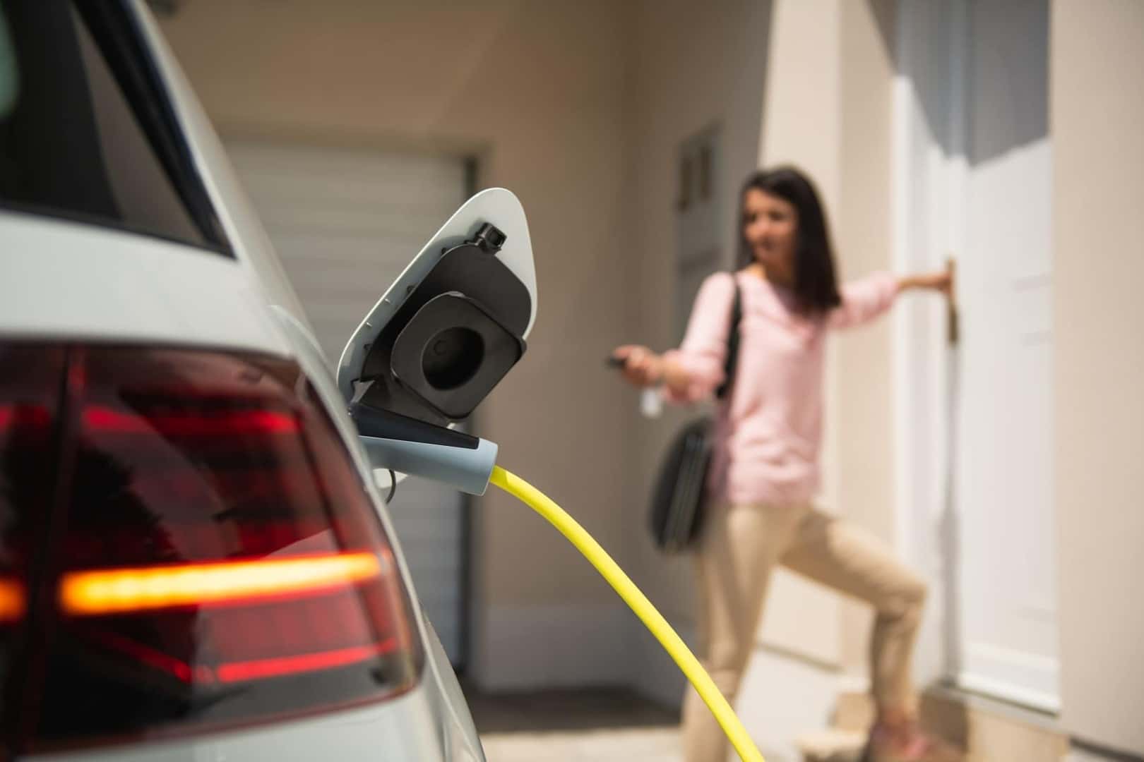 Woman Charging Her Electric Kia