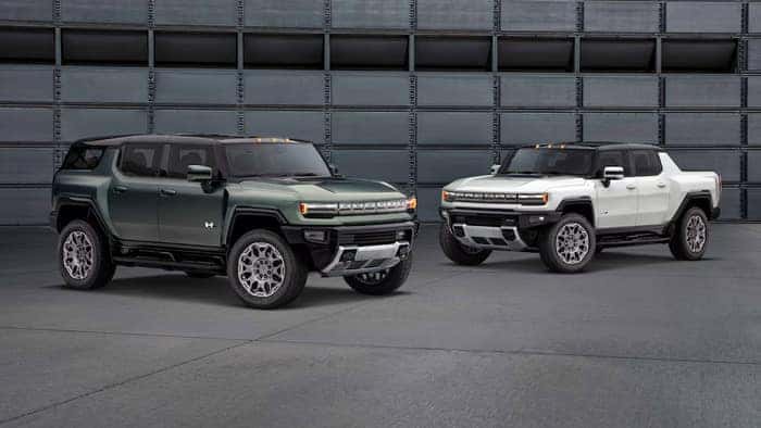 Two Hummer EVs Parked in a Garage