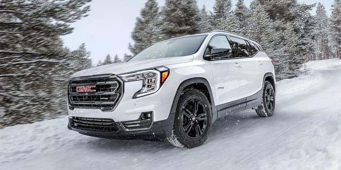 2024 GMC Terrain driving through the snow