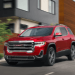 Used GMC Vehicle driving on road