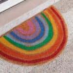 sign rainbow colors doormat front of store entrance against sex discrimination of the LGBT community