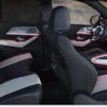 2026 Mercedes-Benz GLE SUV interior featuring two-tone leather seating, digital dashboard displays, and ambient lighting.