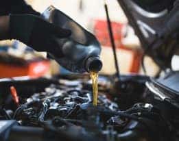 Oil being poured into car engine