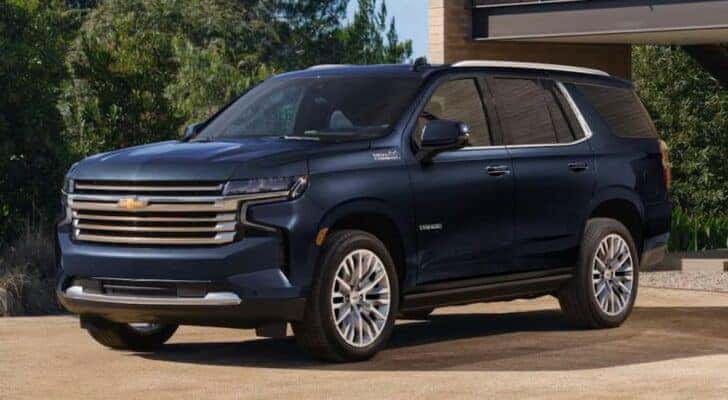 A blue 2023 Chevy Tahoe is shown from the side after leaving a Franklin KY Chevy dealer.