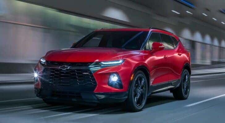 A red 2020 Chevy Blazer RS is shown from the front at an angle while driving through a tunnel.