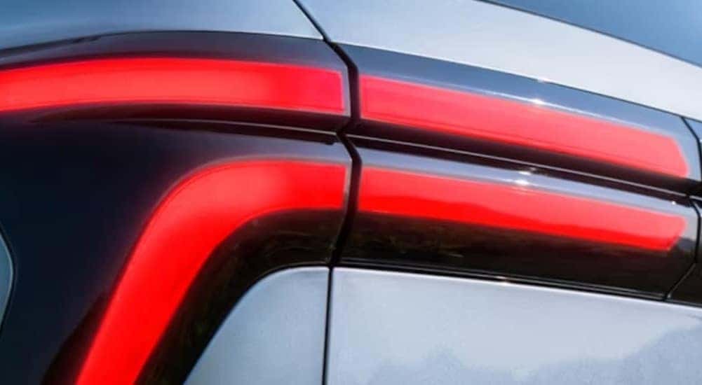 Close-up of the red taillight on a silver 2024 Chevy Traverse