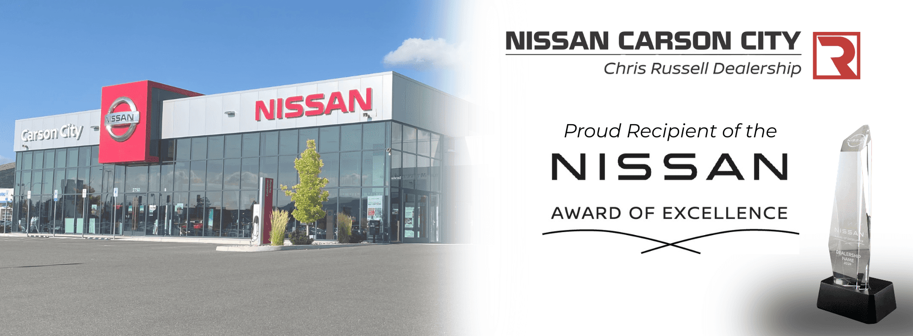 The front of the Nissan Carson City dealership that says "proud recipient of the Nissan Award of Excellence."