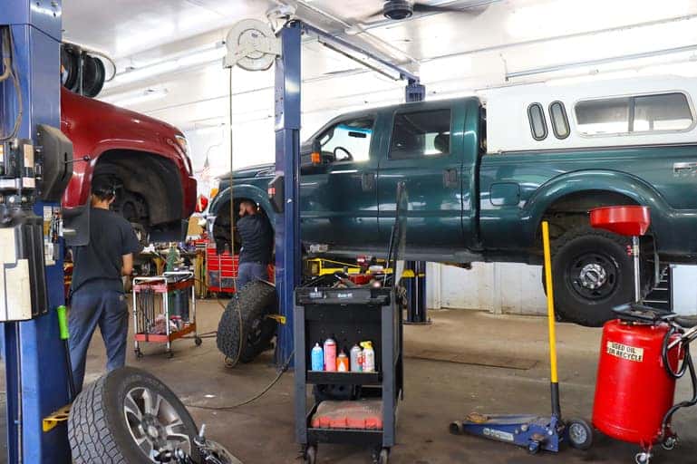 Techs-changing-tires-service