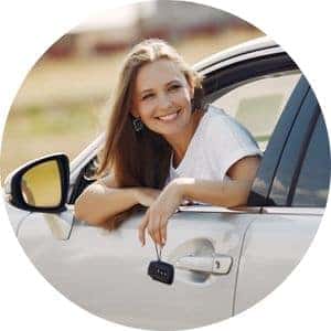 Woman in a Car Holding Keys