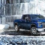 A blue 2022 Chevy Silverado 2500 HD is shown parked in a quarry after leaving a Chevy Silverado dealer.