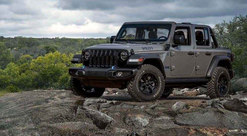 A grey 2022 Jeep Wrangler Willys is shown from the front at an angle.