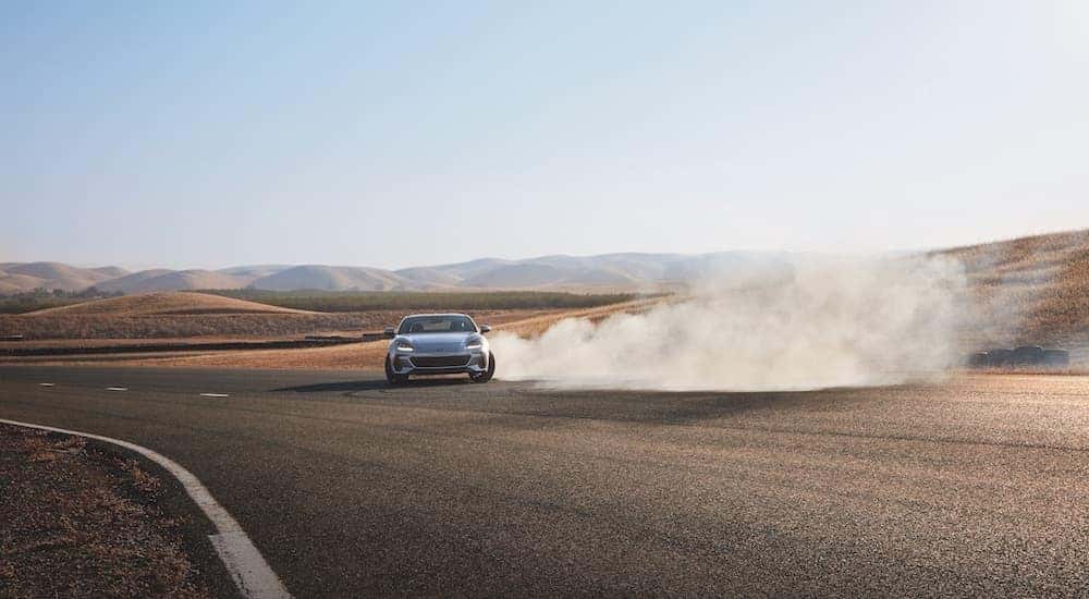 A silver 2022 Subaru BRZ is shown from the front while sliding.