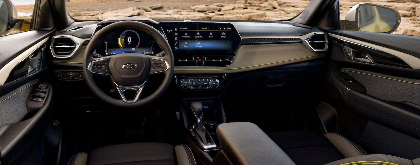 The tan interior of a 2023 Chevy Trailblazer Activ is shown from the driver's seat.
