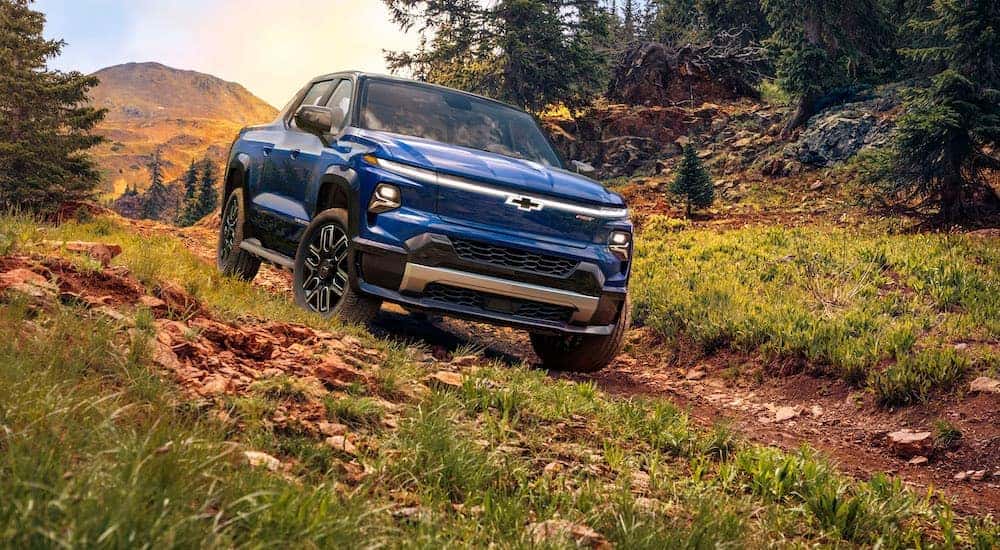 A blue 2024 Chevy Silverado EV RST is shown from the front at an angle.
