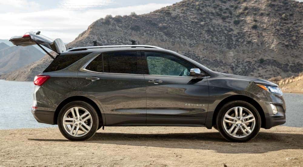A gray 2020 Chevy Equinox is shown parked near water.