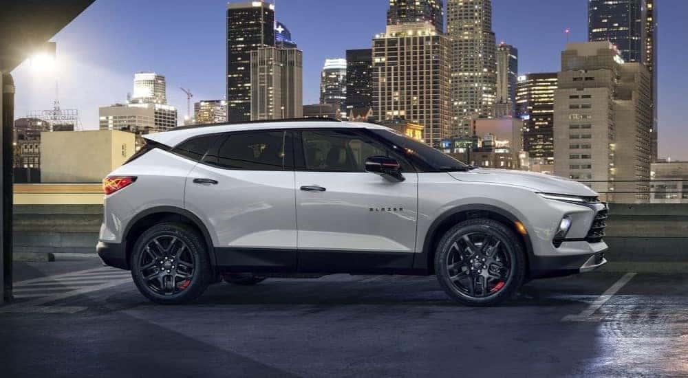 A side view of a parked white 2024 Chevy Blazer Redline.