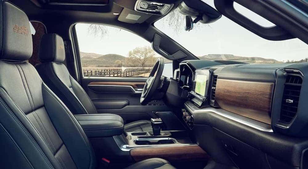 The black interior and dash in a 2024 Chevy Silverado 1500 High Country is shown.